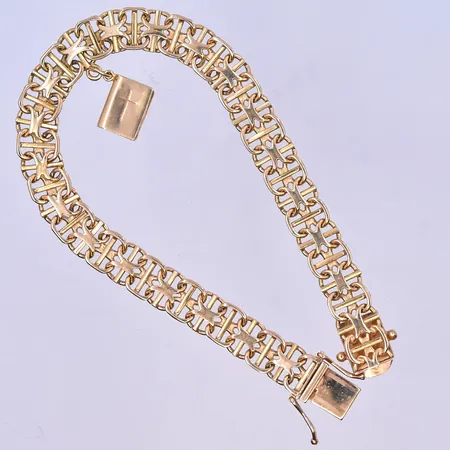 Armband X-länk med en berlock längd 19 cm, bredd 8 mm 18K. Vikt: 16,9 g