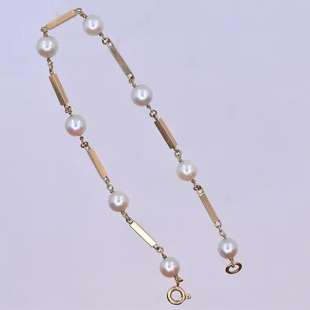 Armband med pärlor längd 20,5 cm, bredd 2mm Ø6 mm 18K. Vikt: 5,4 g