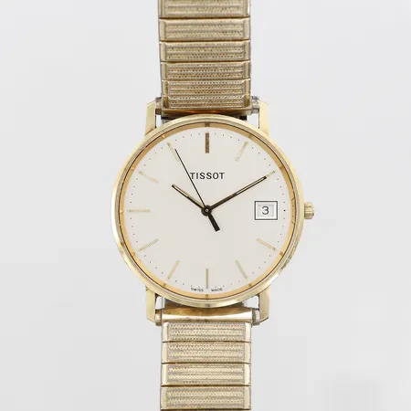 Herrur Tissot 18K 33,5mm, quartz (går ej), datum, gravyr, flexband i guldfärgat stål, inga tillbehör 
