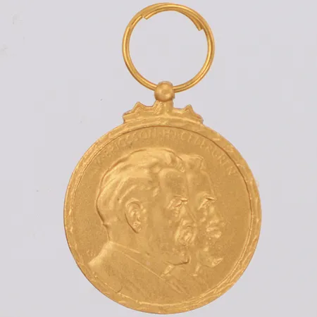 Hänge, För nit och kunnighet i mångårig tjänst, L.M Ericsson, Sporrong, 26x17mm, 18K Vikt: 4,2 g