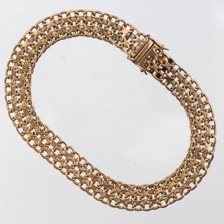 Armband X-länk, Bo Almen Guldatelje,längd 19 cm,bredd 8.4 mm,slitna länkar,18k.  Vikt: 15,7 g