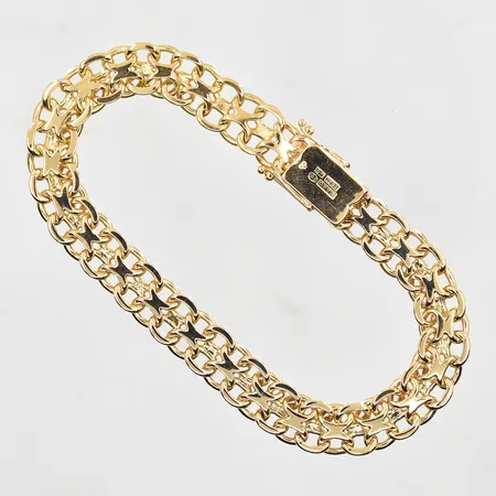 Armband X-länk längd 22½ cm bredd 10 mm, 18K. Vikt: 37,5 g