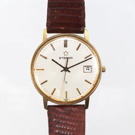 Herrur Eterna,gravyr,diameter ca 33.2 mm,tickar igång men ej funktionstestad.