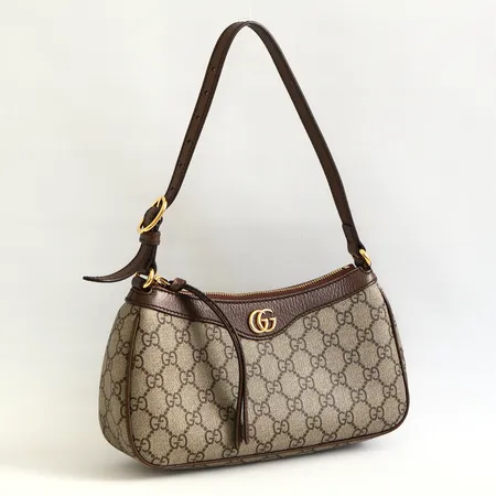 Väska Gucci Ophidia small, monogramcanvas med bruna skinndetaljer, beslag i guldfärgad metall, märkt Gucci made in Italy, numrerad, originalkvitto köpenhamn 2025-02-12, dustbag, låda, midre slitage på lädret i anslutning till dragkedjan. 