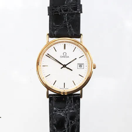 Herrur Omega,gravyr,diameter ca 32.5 mm,fungerar ej,18k.