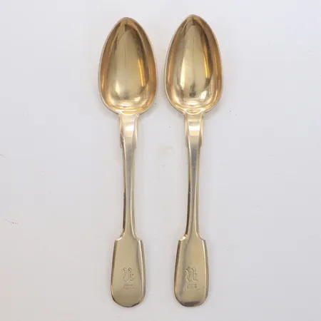 2 Skedar längd 18cm monogram, år 1871, förgyllt 875/1000 silver Vikt: 94,7 g