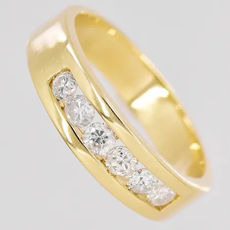 Ring diamanter ca 6x0,10ct stl:19¾ bredd 6mm 14K Vikt: 6,2 g