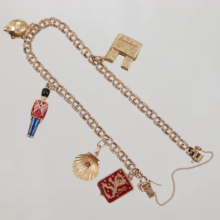 Armband Bismarck med berlocker längd ca 20cm, bredd ca 4mm, tre berlocker i 14K, säkerhetskedja, 18K Vikt: 11,8 g