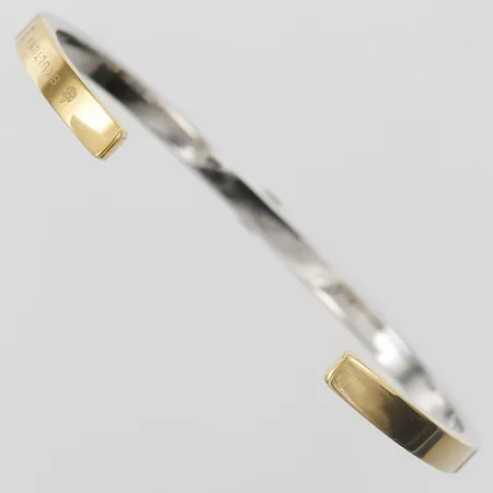 Armband Skultuna Icon Cuff - Two Tone, öppen modell, innermått 60mm, bredd 4mm, förgyllt stål. Nypris 1200:-