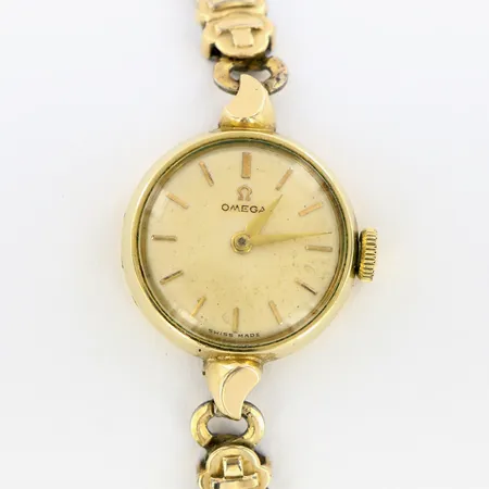 Damur Omega förgylld/stål, boett Ø20 mm, manuell, flexlänk, doublé, Går ej i behov av service, repigt plexiglas, innremått ca15cm, slitage, inga tillbehör