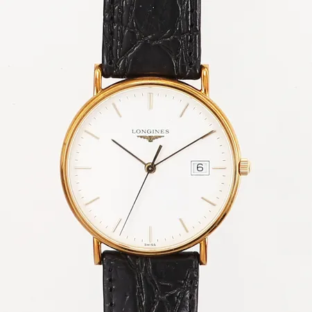 Herrur Longines Ø33,5mm Quartz 18K i boett, original läderarmband, datumfönster, ref: 4.692.6.19.2, snr: 30162766, uttagen 2002, med cert samt etui, baksida med personlig gravyr.