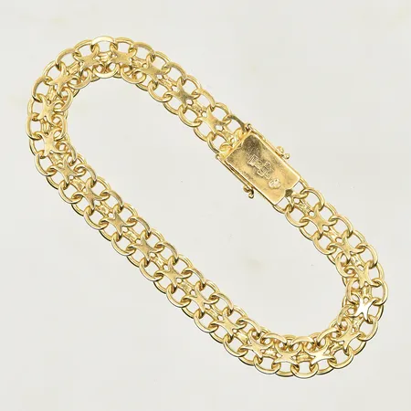 Armband x-länk längd 20½ cm, bredd 9 mm, 18K. Vikt: 22,7 g