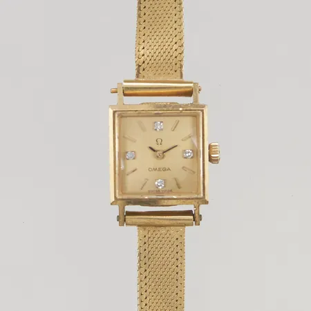 Damur Omega 18K 14mm manuell, diamantindex, länk i 18K, 18-18,5cm, bruttovikt 24,2g.