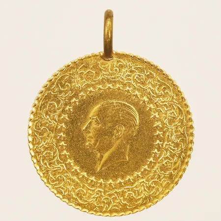  Mynt Ataturk, Ø18mm, ögla i oädel metall, 21,6K.  Vikt: 1,8 g