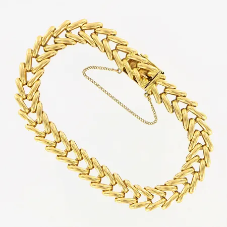 Armband ca 18,5cm, bredd ca 9mm, med säkerhetskedja, 18K Vikt: 26,5 g