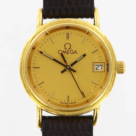 Damur Omega Ø23mm 18K, quartz, läderband, graverad, repigt glas, fungerar ej, garantikort, bok, etui med slitage och färgsläpp