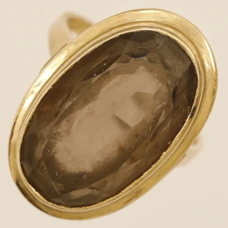 Ring med brun sten stl:18 bredd 2mm 14K bruttovikt 7,6g Vikt: 7,6 g