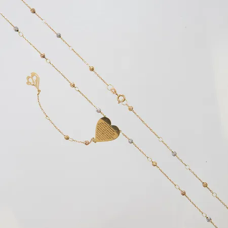 Collier med integrerade kulor, hänge hjärta med inskription på arabiska samt Allahs namn, längd kedja: 55,5cm, längd från hjärtat ner till Allah: 8,7cm, 18K Vikt: 5,2 g