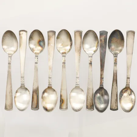 Tio skedar modell Rosenholm, längd 12cm, gravyr, 830/1000 silver Vikt: 167,8 g