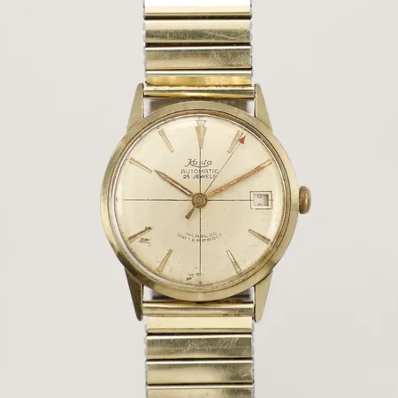 Armbandsur Kasta 14K, automatisk, 32mm, datum, skadat plexiglas och urtavla, buckligt flexarmband i stål, inga tillbehör. 