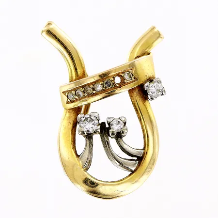Hänge med diamanter 1 x ca 0,08ct 1 x ca 0,05ct 1 x ca 0,03ct 6 x ca 0,01ct, vitguldsdetaljer, längd 26mm, bredd 14,5mm, en diamant saknas, 18K Vikt: 6 g