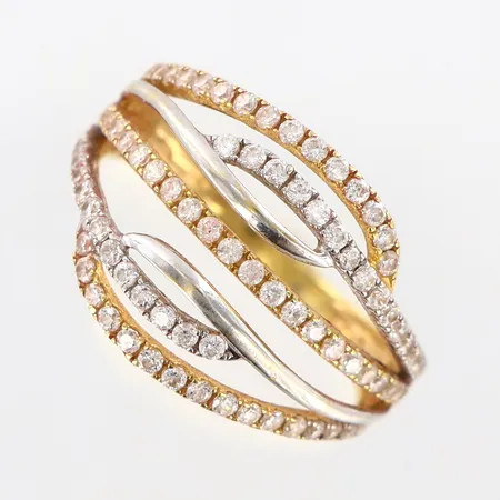 Ring med vita stenar stl: 17¾, bredd 2-14mm, tvåfärgad, saknar stenar, 18K  Vikt: 3,3 g