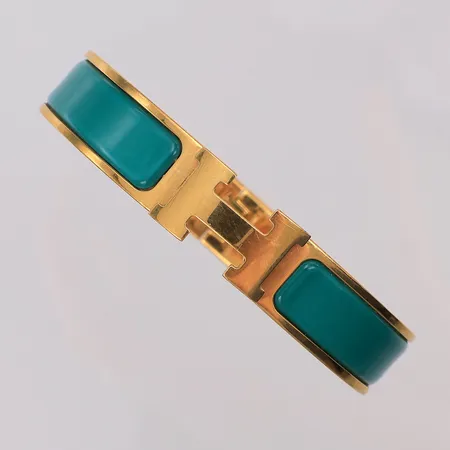 Armband Hermès Clic H märkt Hermès FI 02 91 Made in France 59 x 49mm bredd 12mm, gulmetall turkos emalj, smårepig baksida, dustbag och box.
