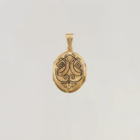Medaljong med dekor 33x24mm en sida med emaljdekor 18K 8,7g.