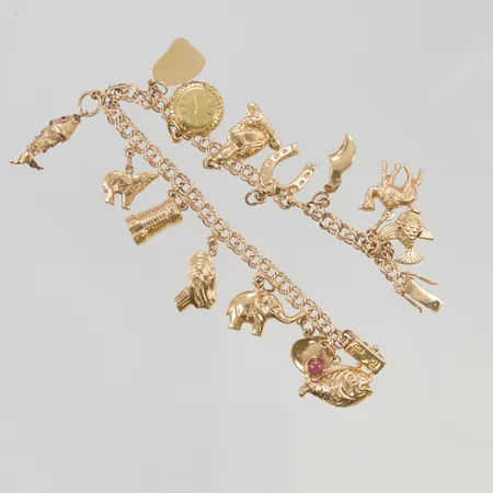 Armband Bismarck 19cm bredd 4mm 14x berlocker 18K 19,6g.