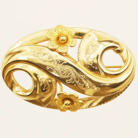Brosch med dekor av blommor, längd 50mm, bredd 33mm, 18K Vikt: 9,1 g