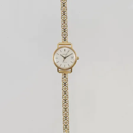 Damur Tissot Seastar 18K 21mm quartz, går ej, x-länk totallängd ca 19,5cm, gravyr, 18K bruttovikt 20,8g.