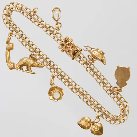 Armband X-länk med berlocker, längd 19cm, bredd ca 5mm, 18K Brv: 12,5g Vikt: 12,5 g