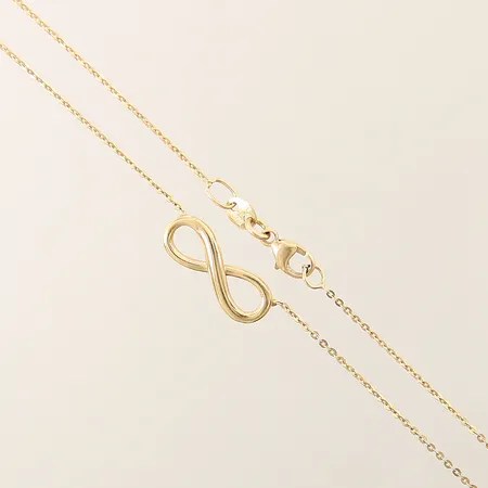 Kedja med integrerat hänge evighetstecken GHA längd 44cm bredd 0,6-6mm 18K Vikt: 1,8 g