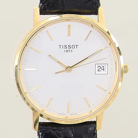 Herrur Tissot 18K quartz Ø33mm, datum, safirglas, läderband original med lätt slitage, doubléspänne, manual, box, i behov av batteribyte, fungerar ej, gravyr, inga tillbehör