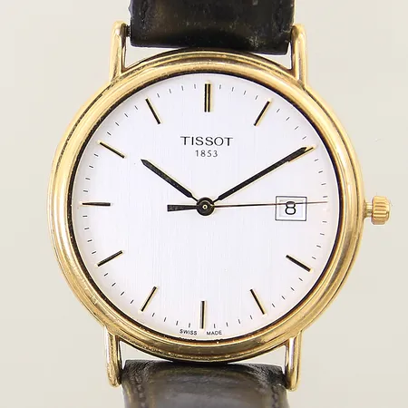 Herrur Tissot 18K quartz Ø34mm, datum, glas saknas, lös bakboett, repig boett, skadat läderband, saknas del till viklås, fungerar ej, i behov av batteribyte
