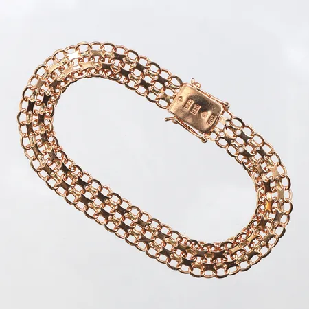 Armband X-länk,Tägt P Gunnar Stockholm,längd ca 17.5 cm,bredd 8.6 mm,18k. Vikt: 12,1 g