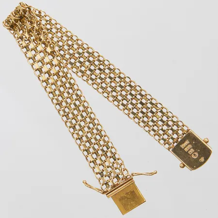 Armband X-länk längd: 19cm, bredd: 12,6mm, svenska stämplar, några skeva länkar, 18K Vikt: 18,2 g