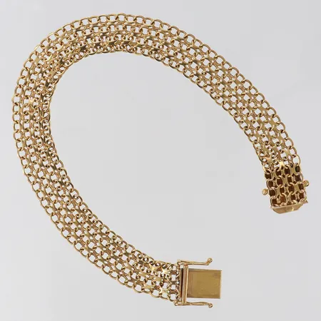 Armband X-länk längd 18cm bredd 10mm bruksslitage 18K.  Vikt: 12,2 g