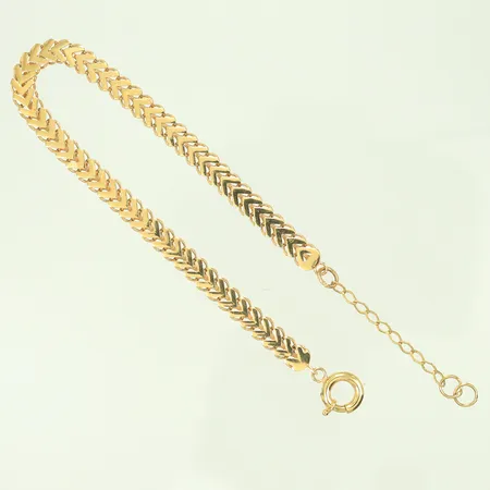 Armband X-länk variant, längd 18-21cm bredd 5mm, vassa kanter, 18K 5,6g Vikt: 5,6 g