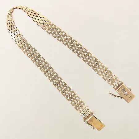 Armband Korridorlänk längd 20cm bredd 7,6mm något ojämn samt en länkbit av vid lås 18K Vikt: 15,2 g