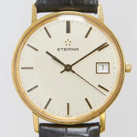 Herrur Eterna 18K quartz 33,5mm, datum, läderarmband, gravyr, bruttovikt: 27,9g