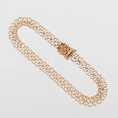 Armband 18k X-länk med stav,längd ca 18 cm,bredd 6.6 mm. Vikt: 6,5 g