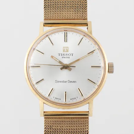 Herrur 18k Tissot Seastar Seven,gravyr,diameter ca 33.5 mm,tickar igång men ej funktiostestad.