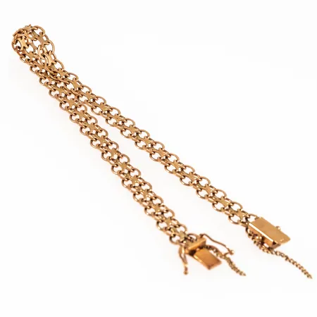 Armband x-länk i 18K guld. Det är 19,2 cm långt, 6 mm brett och väger 7,2g. Kistlås. Defekt säkerhetskedja.