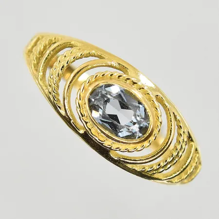 Ring med ljusblå sten, stl 16¾, bredd 2-8 mm, 18K. Vikt: 1,8 g