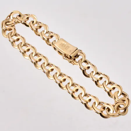 Armband i 18K guld, 19,5cm, Bismarck, bredd 8,5mm, tillverkad av Guldasken Aktiebolag, år 1967, vikt 17,94g.