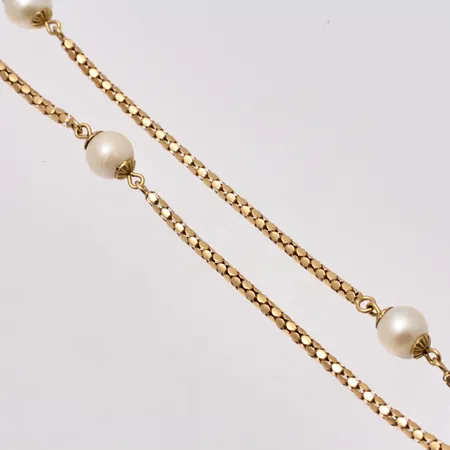 Kedja i 18K guld, 85cm, Popcorn, bredd 2,2-7,5mm, 10st pärlor, mått Ø7,5mm, bruttovikt 20,35g, ca nettovikt 16g.