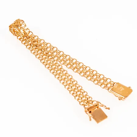 Armband X-länk i 18K guld. Det är 19 cm långt, 8,5 mm brett och väger 10,3g. Fint skick. Kistlås. Stämplad R9 (1967), FE (Guldvarufirman Esto AB, Stockholm), 18K, kattfot.