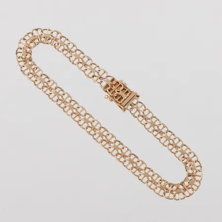 Armband 18k X-länk med stav,längd ca 18.5 cm,bredd 6 mm. Vikt: 6,8 g
