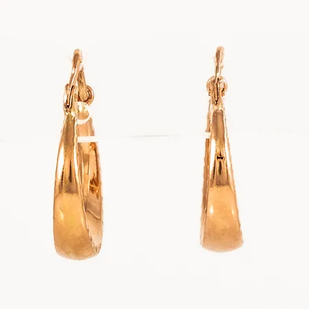 Creoler Ø 16 mm i 18K guld. De är 4 mm bred nertill, 20,5 mm långa och väger 1,8g. 